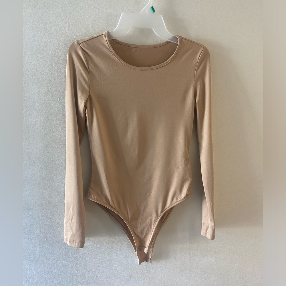 Tan colored bodysuit. Size small